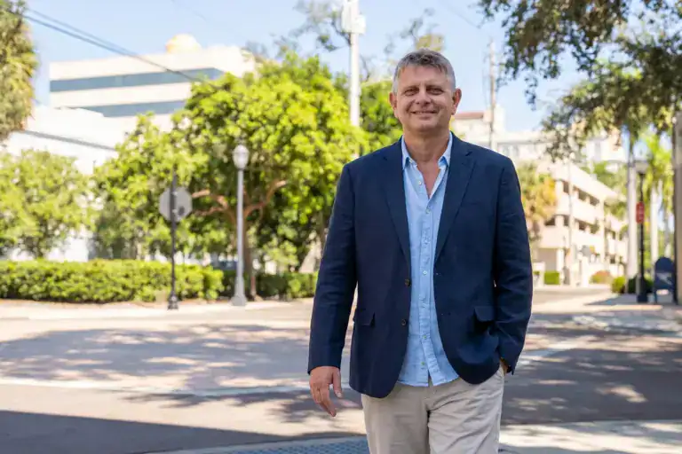 Axel Weiss, broker at Sea to Sky Realty, walking through downtown Bradenton, Florida