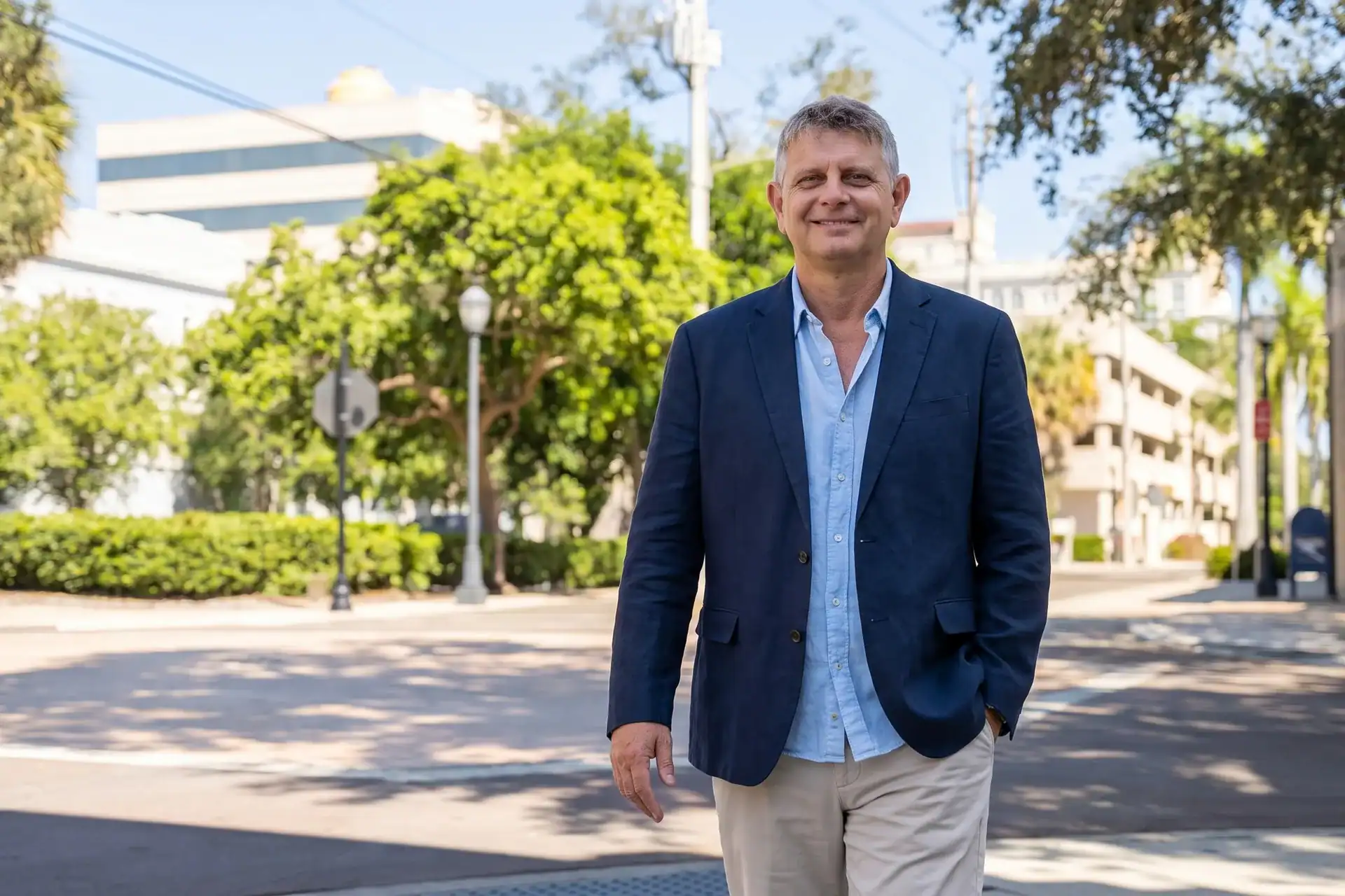 Axel Weiss, broker at Sea to Sky Realty, walking through downtown Bradenton, Florida