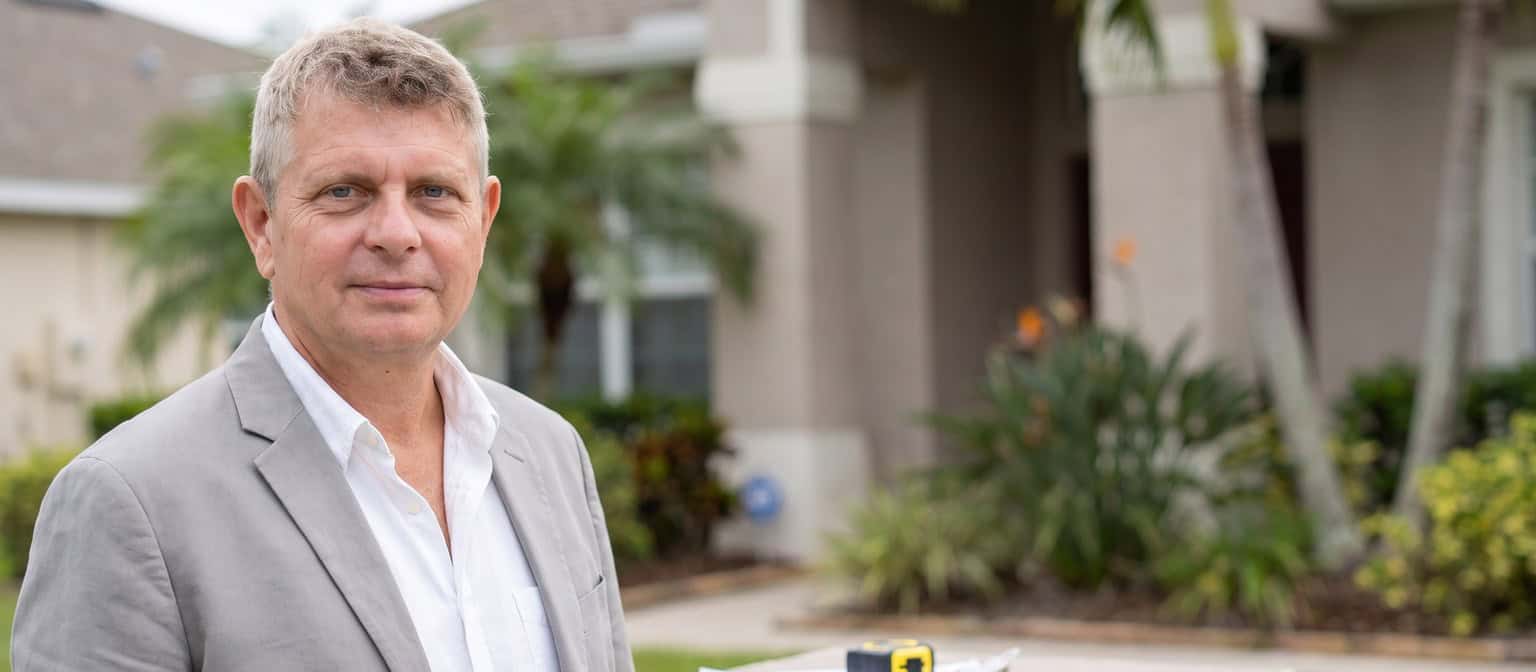 Axel Weiss, Broker at Sea to Sky Realty, assessing a home value in Bradenton, Florida