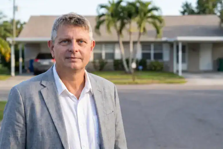 Axel Weiss, broker at Sea to Sky Realty, in front of a Florida investment property